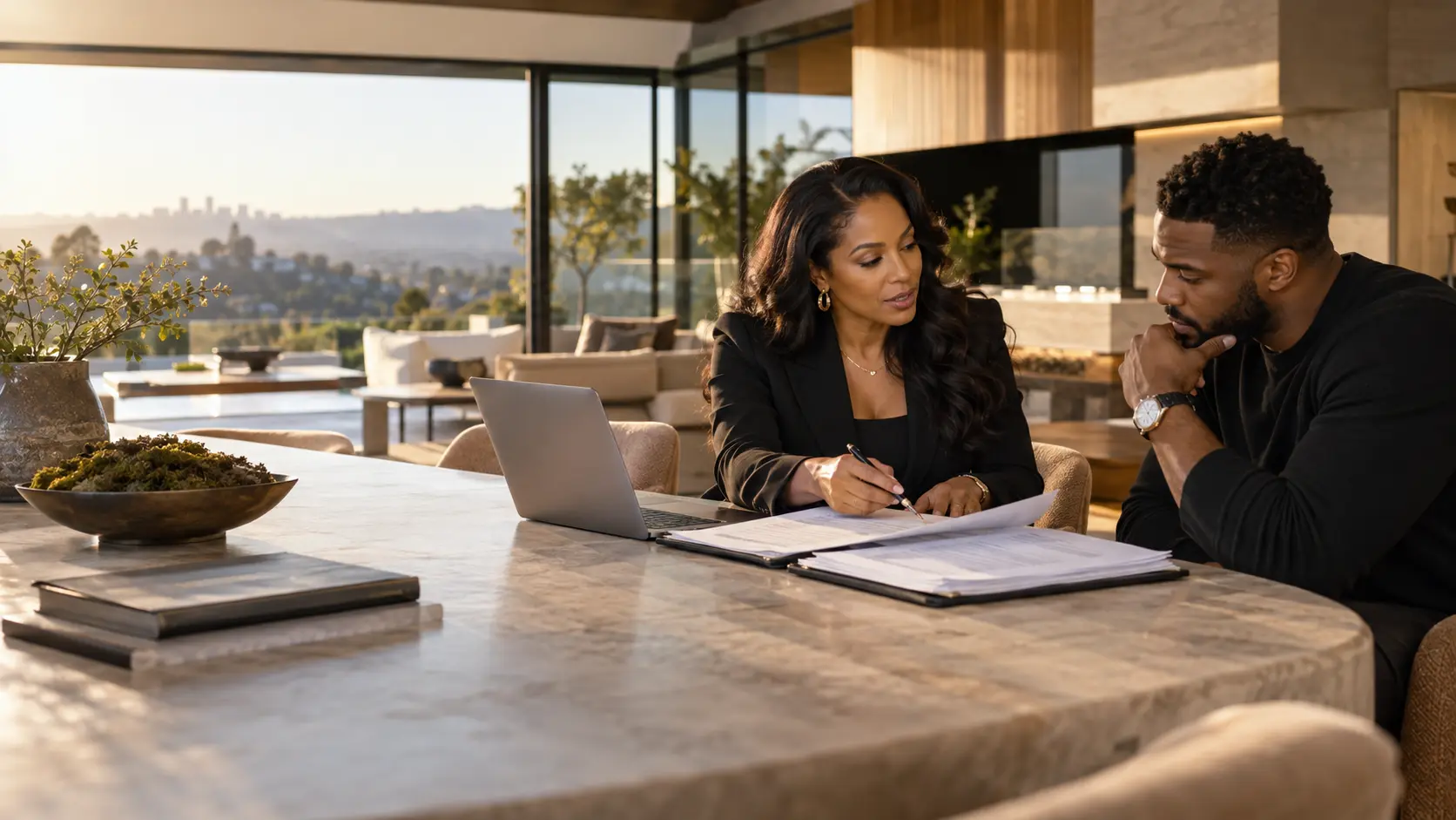 Real estate mentor guiding a student through purchase documents in a modern home